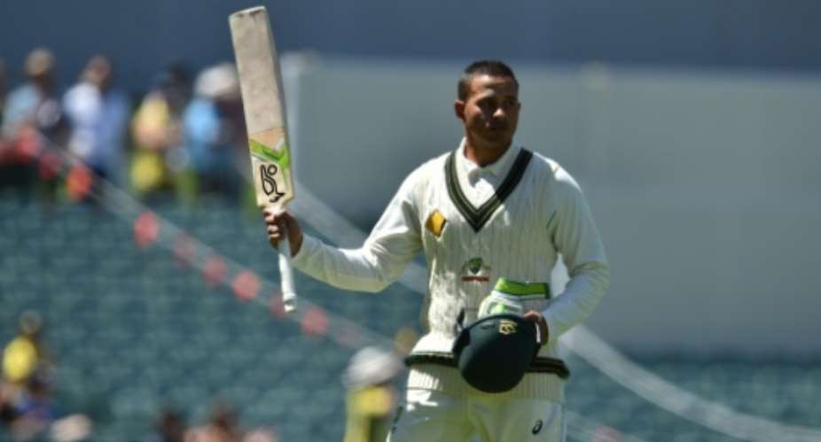Australian batsman Usman Khawaja acknowledges the crowd after being dismissed on the third day of the third Test against South Africa in Adelaide on November 26, 2016.  By Peter Parks AFP