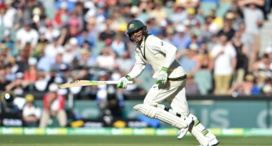 Australian batsman Usman Khawaja runs to make a century during the second day of the third Test cricket match against South Africa at the Adelaide Oval.  By Peter Parks AFP