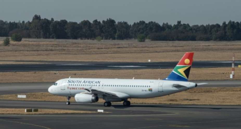 Back in business: The SAA flight readies for takeoff at Johannesburg's O.R. Tambo airport.  By Emmanuel Croset AFP