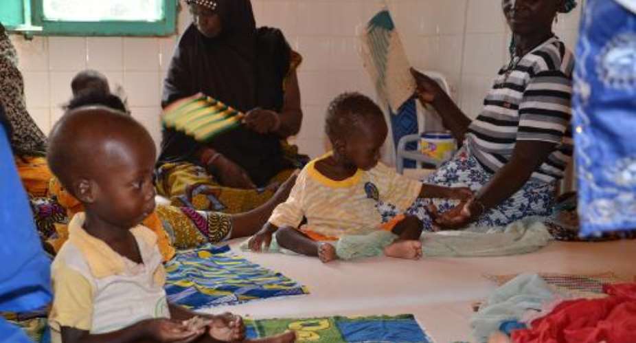 A picture taken on October 14, 2013 shows children at a hospital in Tillaberi, western Niger.  By Boureima Hama AFPFile