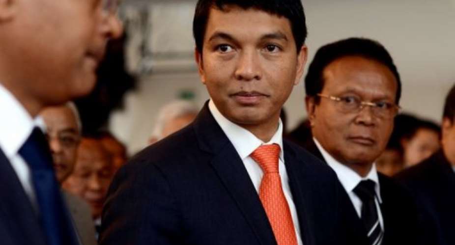 Madagascar strongman Andry Rajoelina, pictured (C) at a ceremony in Antananarivo Town Hall, on May 13, 2013.  By Bilal Tarabey (AFP/File)
