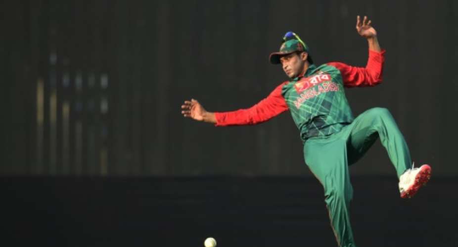 Bangladesh's Shakib Al Hasan stretches for a catch during the first T20 cricket match against Zimbabwe at in Khulna, Bnagladesh, on January 16, 2016.  By Munir Uz Zaman AFP