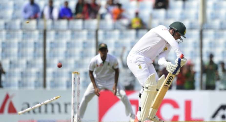 South Africa's Quinton de Kock front is bowled by Bangladesh's cricketer Mustafizur Rahman during the opening day of the first Test match at the Zahur Ahmed Chowdhury Stadium in Chittagong, on July 21, 2015.  By Munir Uz Zaman AFP