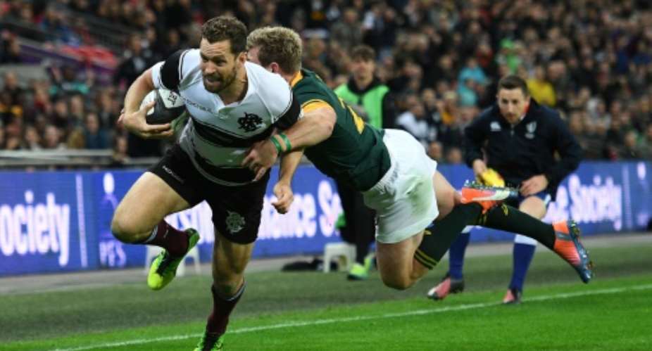 Barbarians Australian player Luke Morahan scores a try during their match against South Africas Springboks at Wembley Stadium in London on November 5, 2016.  By Justin Tallis (AFP)