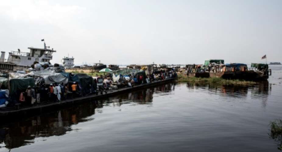 Barges at a port on the Congo River. Lack of roads means that the waterways are widely used for transport in DR Congo, and accidents are common.  By JOHN WESSELS AFP