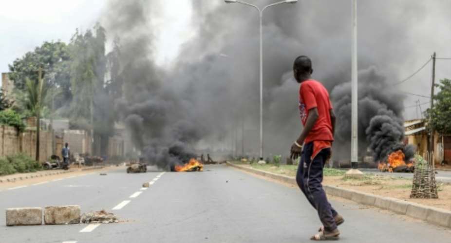 Barricades were burned as anti-government protesters took to the streets in Lome.  By YANICK FOLLY AFP