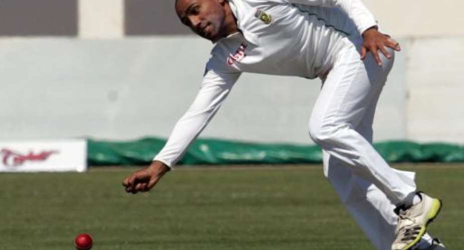 South Africa's Dane Piedt in action during the first day of a Test match against Zimbabwe at the Harare Sports Club, on August 9, 2014.  By Jekesai Njikizana AFP