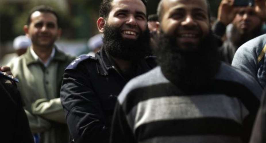 A bearded Egyptian police officer takes part in a protest in Cairo on March 1, 2013.  By Gianluigi Guercia AFP