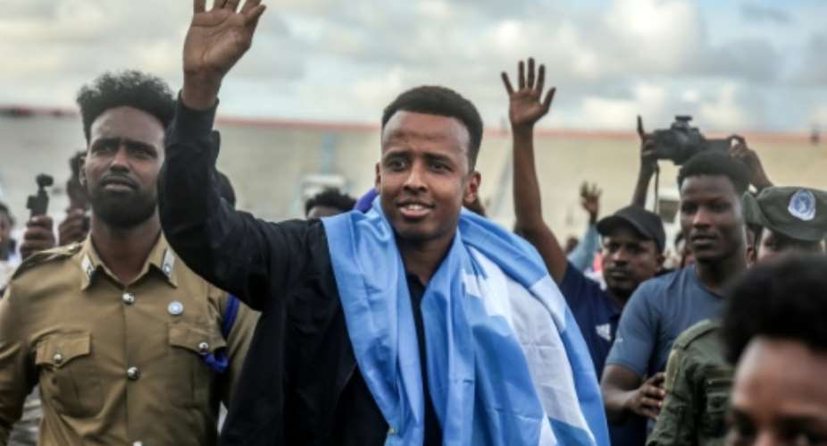 Before the World Cup started in June, Omar Artan (C) unwittingly found himself in the media spotlight after being turned away on arrival at Miami International Airport.  By Hassan Ali Elmi (AFP/File)