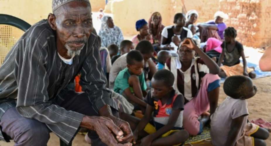 Belem Boureima, a 74-year-old farmer, and his family. They are among the hundreds of thousands of people in Burkina Faso who have fled their homes because jihadist attacks.  By ISSOUF SANOGO AFP