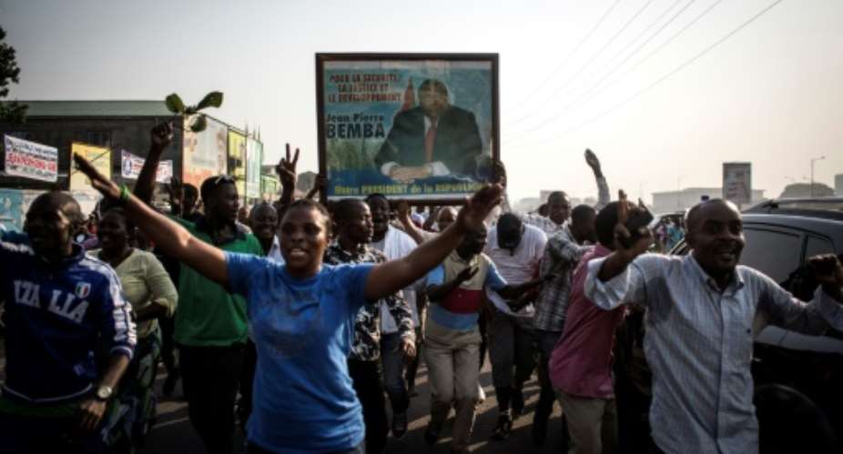 Bemba's supporters celebrate in Kinshasa on June 8 after he was acquitted on appeal.  By JOHN WESSELS AFPFile