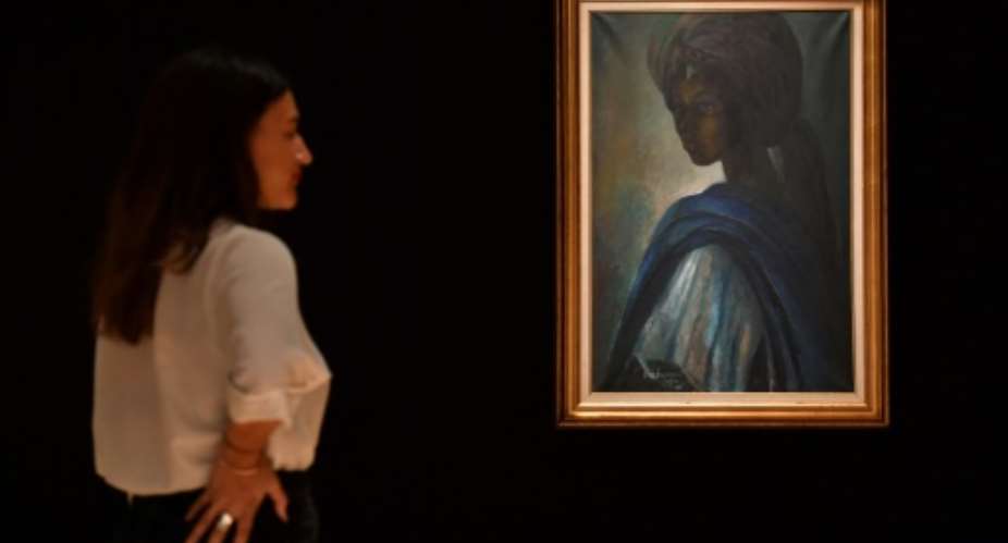 Ben Enwonwus 1974 painting of the daughter of a Yoruba king has taken on almost mythical status in Nigeria.  By BEN STANSALL (AFP)