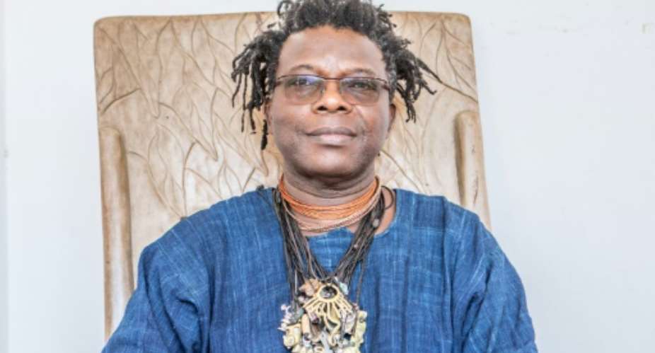 Benin artist Romuald Hazoume says politicians who downplay or deny global warming as absolutely irresponsible and in denial..  By Yanick Folly AFP