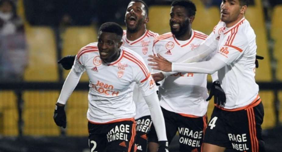 Benjamin Moukandjo L celebrates with his Lorient teamamtes after scoring a goal during a French Ligue 1 football match.  By Jean Christophe Verhaegan AFPFile