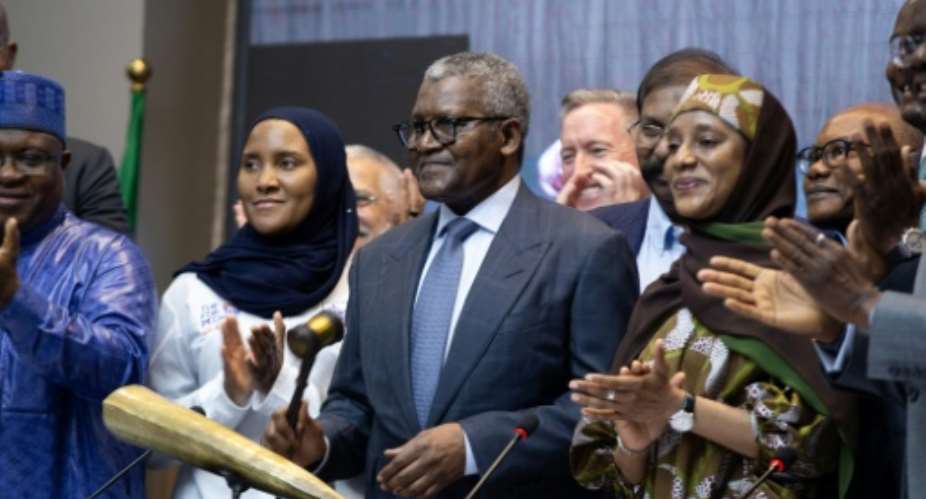 Billionaire Aliko Dangote (C) launched an IPO of his refinery, which has become the largest supplier of jet fuel to Europe.  By Temiloluwa Johnson (AFP)