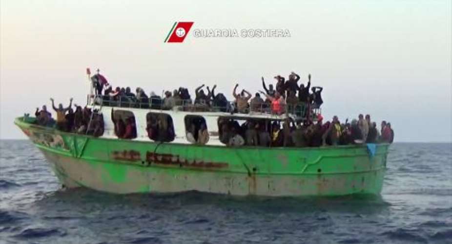 A grab from an an Italian Coast Guards video on May 6, 2015 shows migrants on a boat off the coast of Sicily awaiting rescue under Operation Triton.  By  Guardia CostieraAFPFile