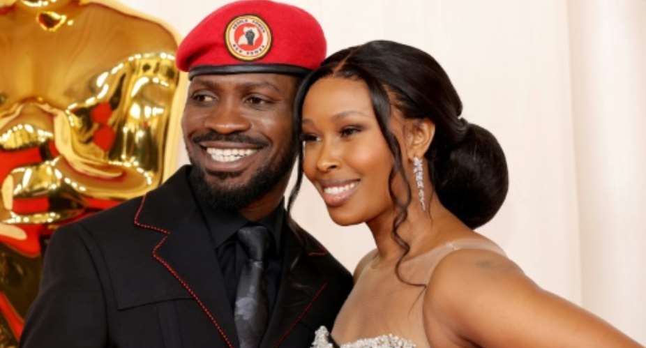 Bobi Wine and his wife, Ugandan  philanthropist Barbie Kyagulanyi, at the 2024 Academy Awards.  By Mike Coppola (GETTY IMAGES NORTH AMERICA/AFP)