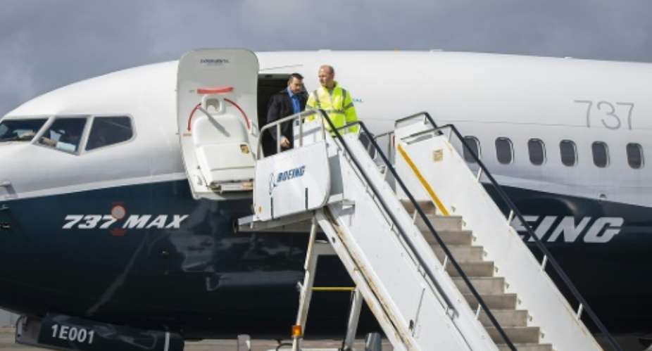Boeing Chief Executive Dennis Muilenburg deplaning a Boeing 737 MAX after a test flight of the company's proposed fix to its anti-stall system.  By Marian Lockhart BOEINGAFP