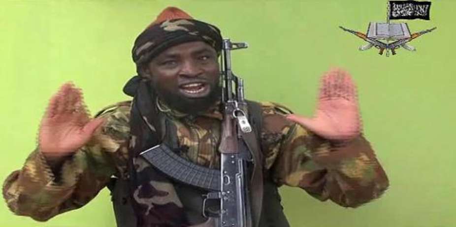 A screengrab taken on May 12, 2014, from a video released by Nigerian Islamist extremist group Boko Haram shows a man claiming to be the leader of the group.  By  BOKO HARAMAFP