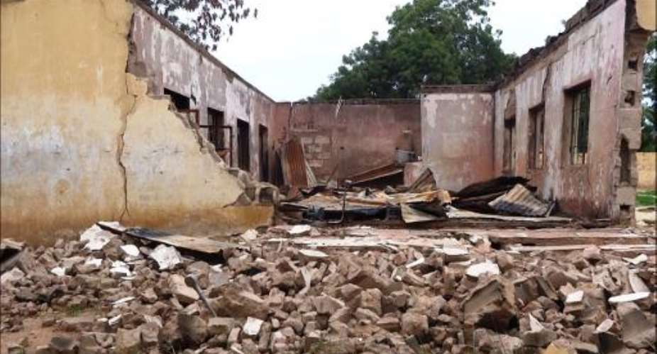 This picture taken on August 6, 2013 shows a blown up students hostel in the Government Secondary School of Mamudo, in the northeastern Nigerian Yobe state, after an attack by Boko Haram gunmen.  By Aminu Abubakar AFPFile