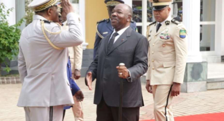 Bongo, seen here at a wreath-laying ceremony on August 16, sparked intense speculation about his fitness to govern after he fell ill with a stroke. He is scheduled to host an 11-nation regional summit on Wednesday.  By STEVE JORDAN AFPFile