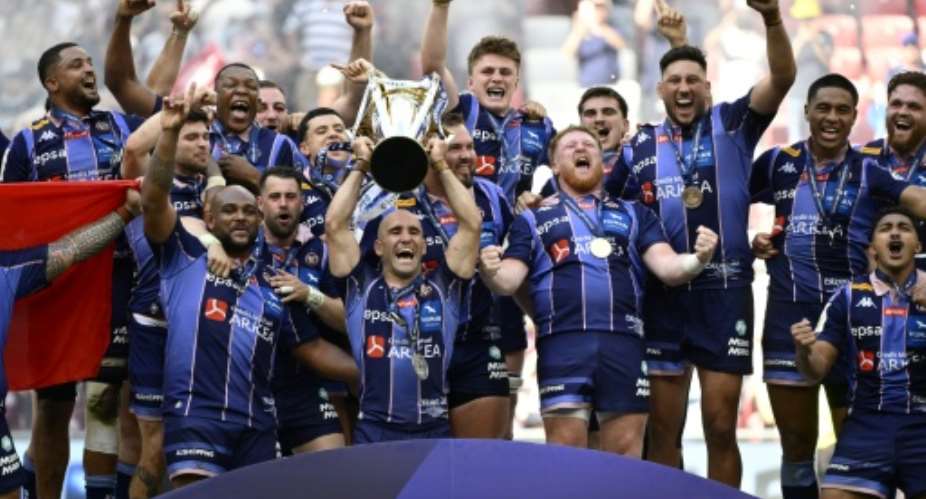 Bordeaux-Begles players celebrate winning the 2026 Champions Cup.  By Ander Gillenea (AFP/File)