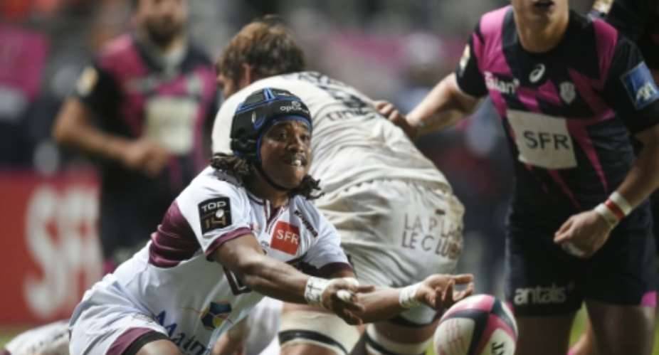 Bordeaux-Begles' South African scrumhalf Heini Adams gets a ball out of a scrum during the French rugby union Top 14 match beetween Stade Francais Paris and Bordeaux-Begles, on December 5, 2015.  By Martin Bureau AFP