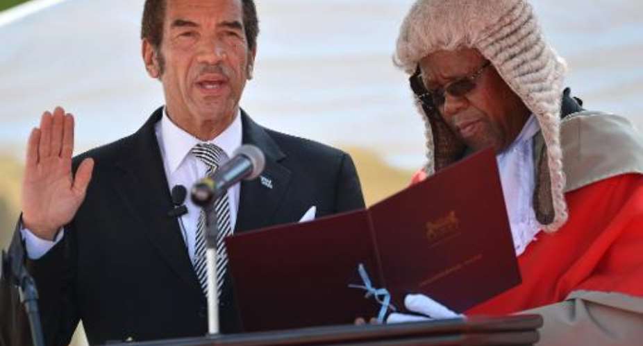 Botswana's President Ian Khama takes the oath of office during a ceremony as he was sworn in for his second term on October 28, 2014 in Gaborone.  By Monirul Bhuiyan AFP