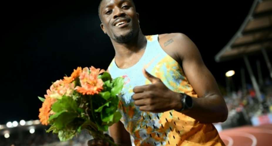 Botswanas Letsile Tebogo celebrates winning the mens 200m at the Lausanne Diamond League.  By Fabrice COFFRINI (AFP)