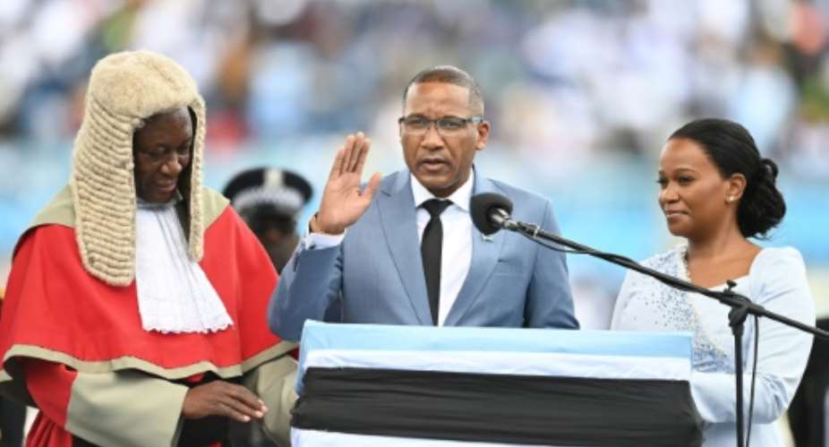 Botswana€s new president Duma Boko (C) was sworn in, a week after his landslide election victory.  By Monirul Bhuiyan (AFP)