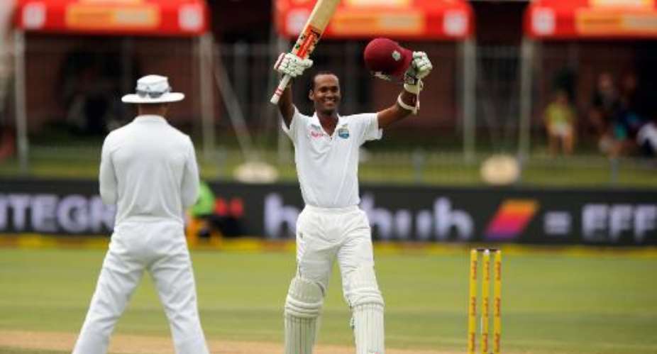 West Indies batsman Kraigg Brathwaite C celebrates his century during the fourth day of the second Test against South Africa at St George's Park in Port Elizabeth on December 29, 2014.  By Marco Longari AFP