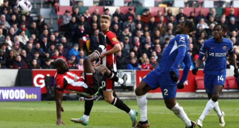 Brentford forward Yoane Wissa L attempts an overhead kick against Chelsea..  By Darren Staples AFP