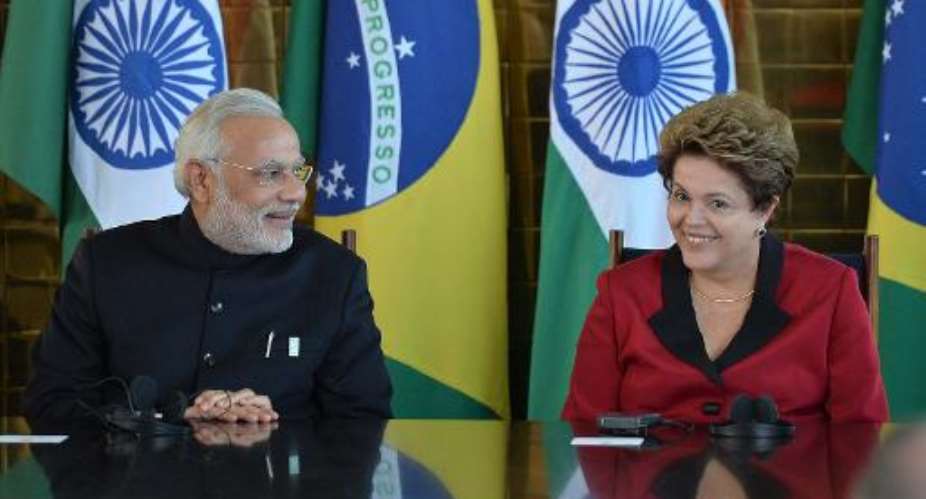 Brazilian President Dilma Rousseff R talks with Indian PM Nerendra Modi at the presidential palace in Brasilia, on July 16, 2014.  By Edilson Rodrigues AFP