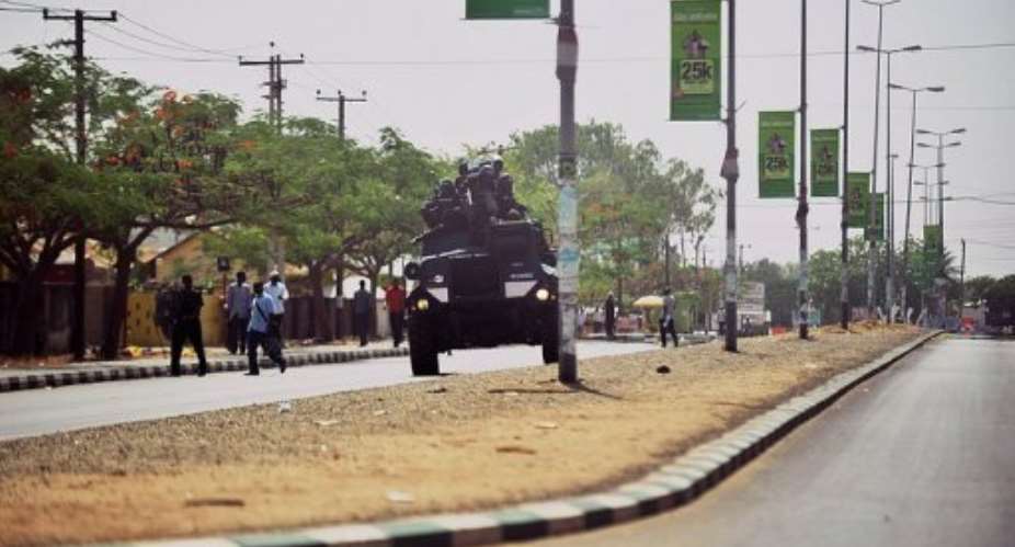Nigerian police enforce a curfew in Bauchi, capital of Bauchi state, northern Nigeria, on April 18, 2011.  By Tony Karumba AFPFile