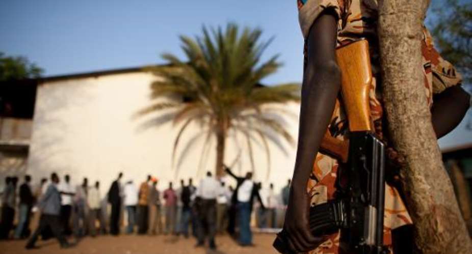 Southern Sudanese police stand guard outside a polling station in Juba on January 9, 2011.  By Trevor Snapp AFPFile