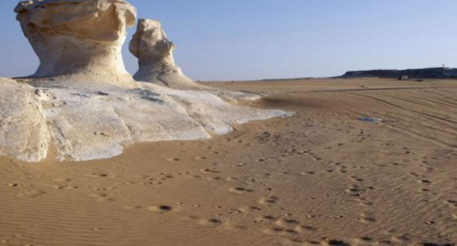 Human and vehicle track mark areas at the base of chalk Inselbergs.  By Cris Bouroncle (AFP/File)