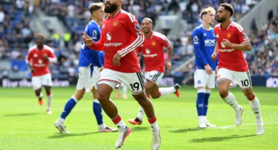 Bryan Mbeumo (L) celebrates scoring for Manchester United at Everton.  By PETER POWELL (AFP)