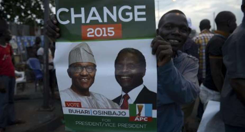 Supporters of  All Progressives Congress APC celebrate on March 31, 2015 in Lagos.  By Pius Utomi Ekpei AFP