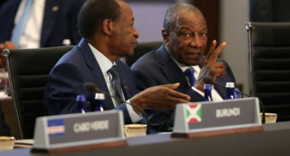 Burkina Faso's former president Blaise Compaore L talks with Guinean counterpart Alpha Conde before the first plenary meeting of the US-Africa Leaders Summit at the State Department in August  2014 in Washington, DC..  By CHIP SOMODEVILLA GETTY IMAGES NORTH AMERICAAFP
