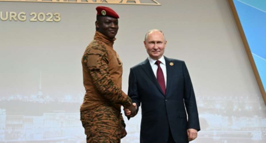 Burkina Faso's junta leader  Ibrahim Traore, left, with Russian President Vladimir Putin in Saint Petersburg in July 2023.  By Pavel BEDNYAKOV (POOL/AFP)