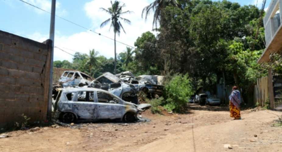 Burned-out cars as a result of ongoing gang violence in the main town in Mayotte.  By Gregoire MEROT AFP