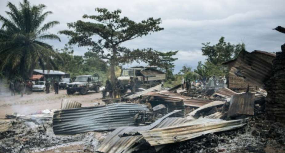Burnt down houses are seen  in the village of Manzalaho near Beni, Democratic Republic of Congo on February 18, 2020, following an attack  allegedly perpetrated by the rebel group Allied Democratic Forces ADF.  By Alexis Huguet AFPFile