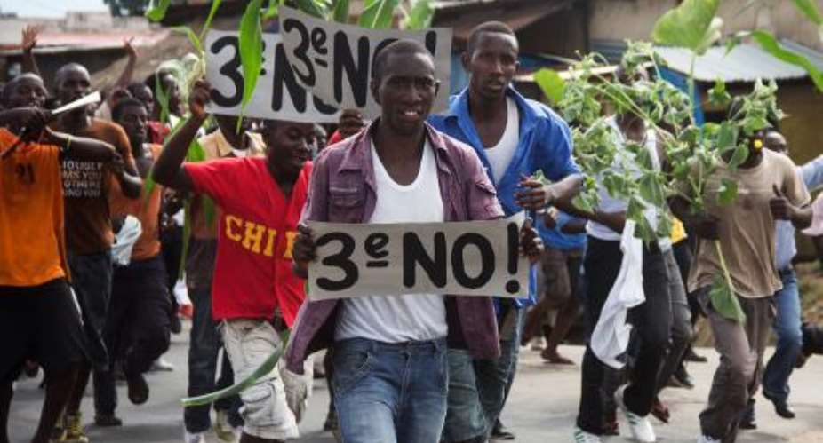 Demonstrators protest against President Pierre Nkurunziza's bid for a third term in power in Burundi's capital Bujumbura on April 27, 2015.  By Landry Nshimiye AFP