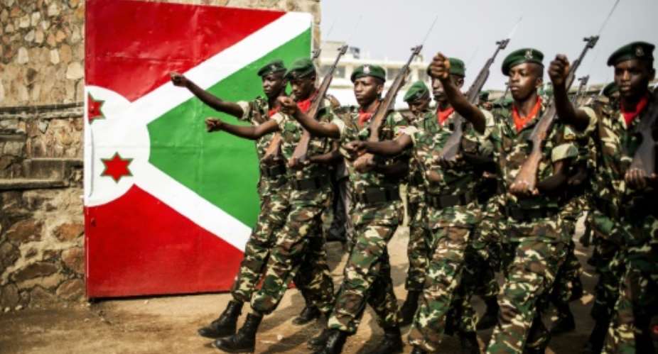 Burundi soldiers march at the entrance of the Prince Rwagasore Stadium in Bujumbura during independence anniversary celebrations on July 1, 2015.  By Marco Longari AFP