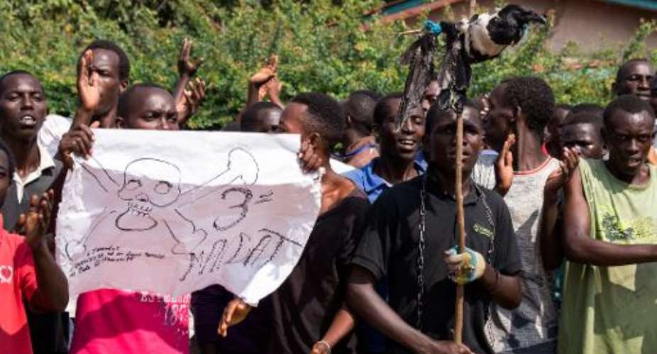 Protesters opposed to Burundian President Pierre Nkurunziza seeking a third term  demonstrate in Musaga, a neighborhood of Bujumbura, on May 29, 2015.  By Landry Nshimiye AFP
