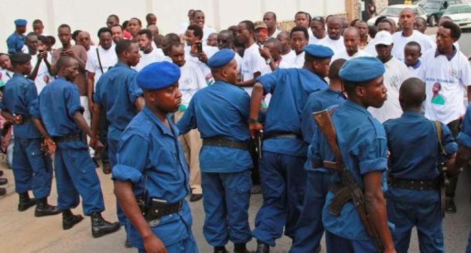 Police contain protestors appealing to end journalist Hassan Ruvakukis jail sentence in Bujumbura on February 19, 2013.  By Esdras Ndikumana (AFP/File)