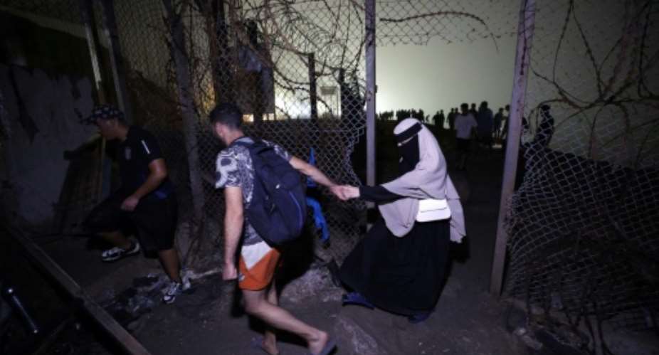 By Friday evening officials said more than 48,000 migrants had already returned.  By Abdel Majid BZIOUAT (AFP)