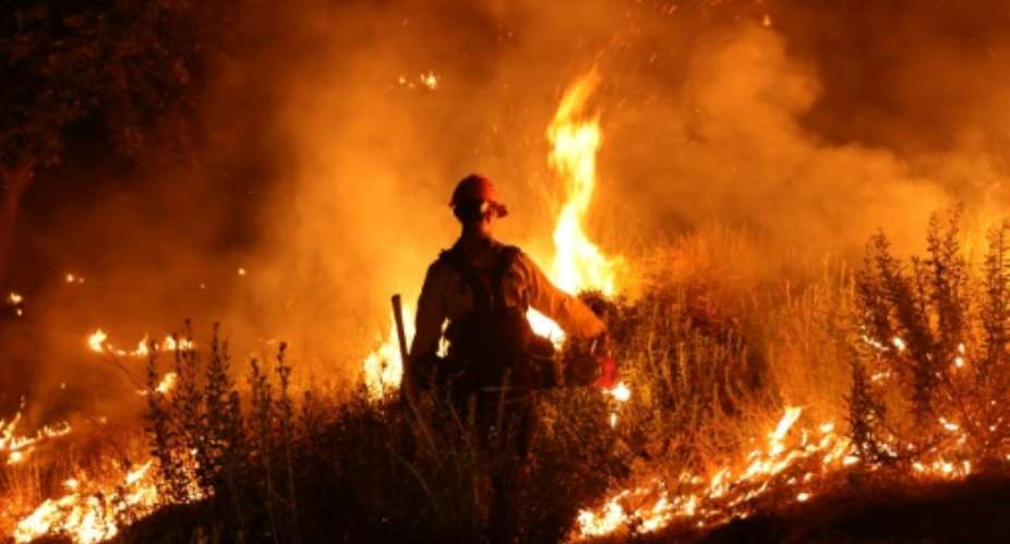 California is fighting numerous wildfires, including one in Riverside County that has burned thousands of acres and prompted evacuation orders.  By DAVID SWANSON (AFP)