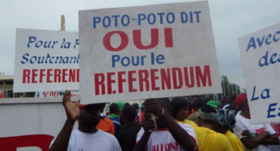 Supporters of Congolese President Denis Sassou Nguesso rally in Brazzaville on October 10, 2015 to back the presidents controversial bid to change the constitution.  By Laudes Martial Mbon (AFP/File)