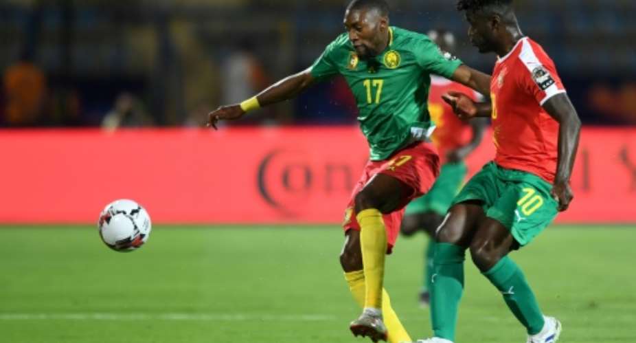 Cameroon forward Karl Toko Ekambi L attacks against Guinea-Bissau at the Africa Cup of Nations in Egypt.  By OZAN KOSE AFPFile